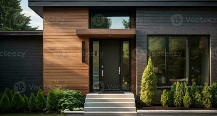 Contemporary exterior of home with dark ceramic tiles as siding of ...
